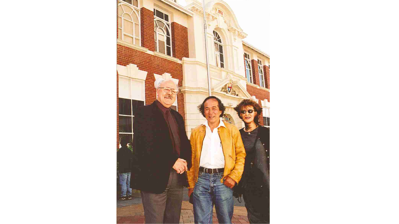 Bruce McDonald stands with John Wing and his sister, Grace Guest in 2000 on Swinburne's hawthorn campus.