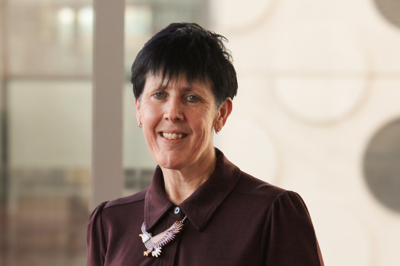 Dr Sarah Barradell standing inside a Swinburne building