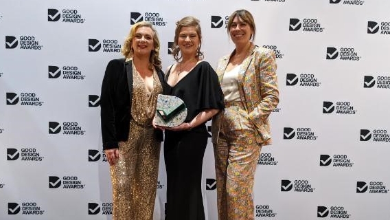 Swinburne Director and Associate Professor of Higher Education, Dr Nadine Zacharias (centre) stands with consultants Dr Laura Kostanski (left) and Sara Pateraki from The Growth Drivers at The Good Design Awards ceremony in Sydney.
