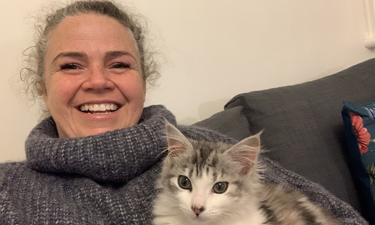 Swinburne employee Sally McArthur at home with her cat Lola