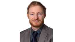 Professional headshot of Swinburne alumni Andrew Heinrichs, Director of Safety at the Department of Justice and Community.