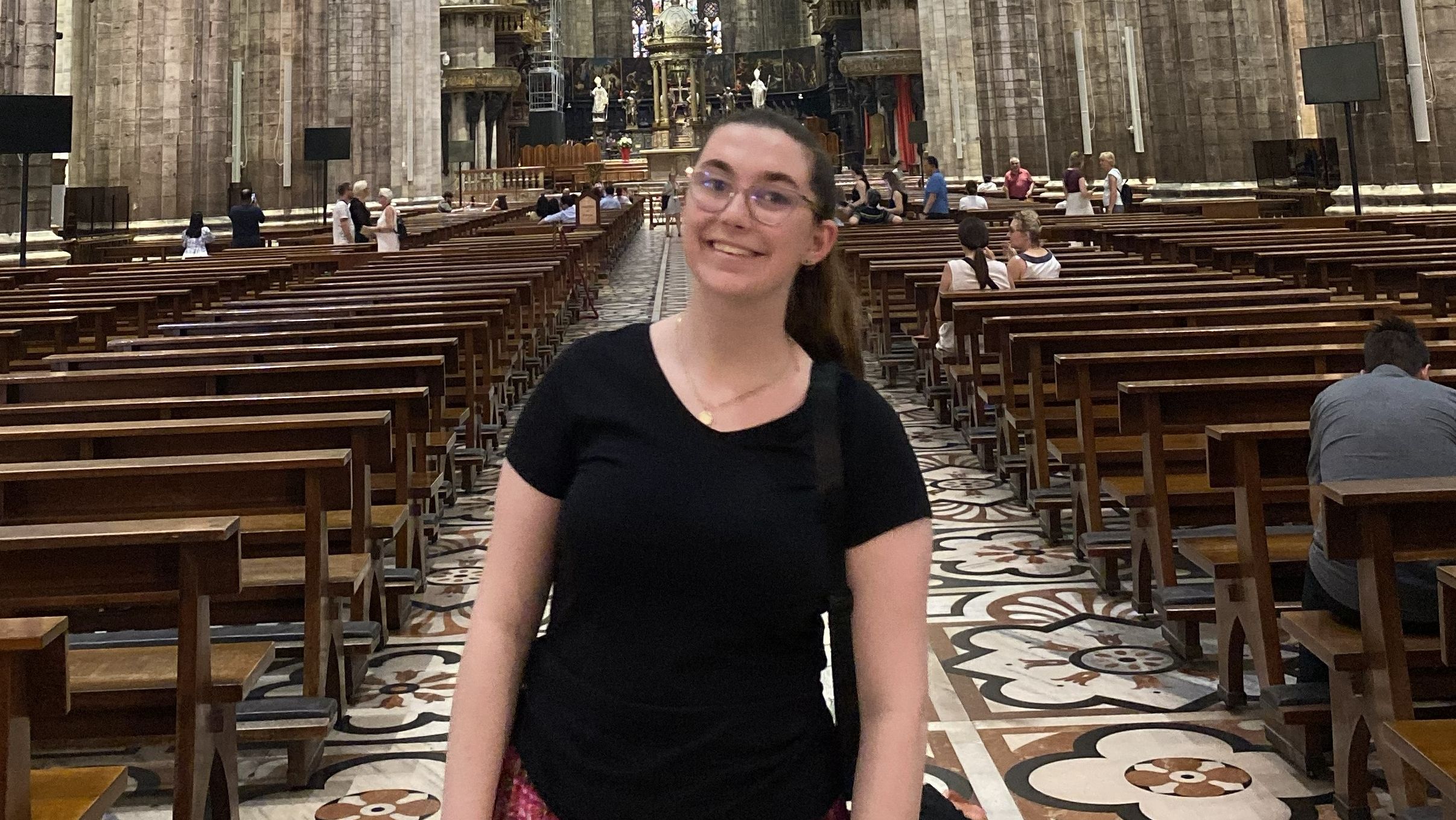 Woman standing inside a church