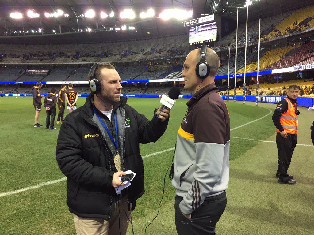 Photograph of Swinburne alumnus Sam Duncan working at Etihad Stadium.