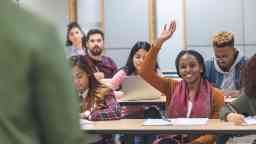 University students attentively engaged in tutorial discussions and questions time.,