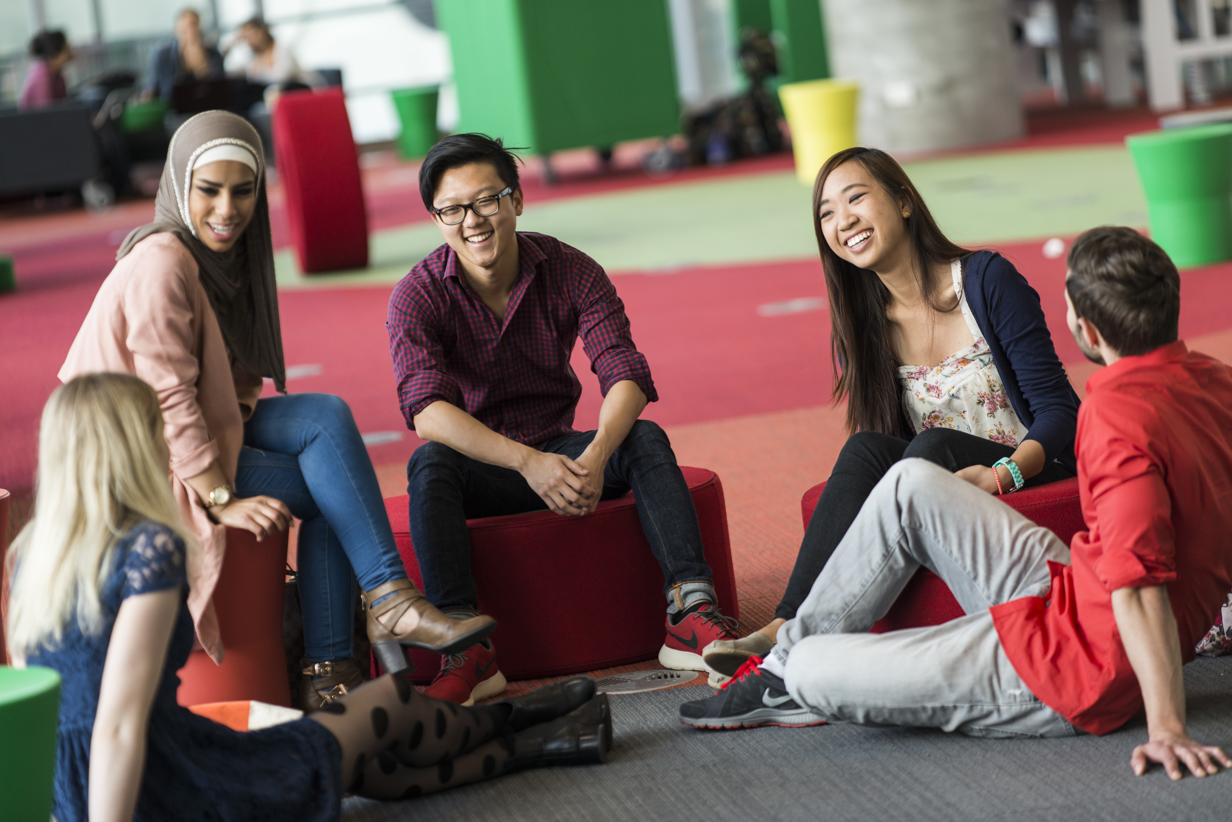 Group of students sitting around Hawthorn campus socialising