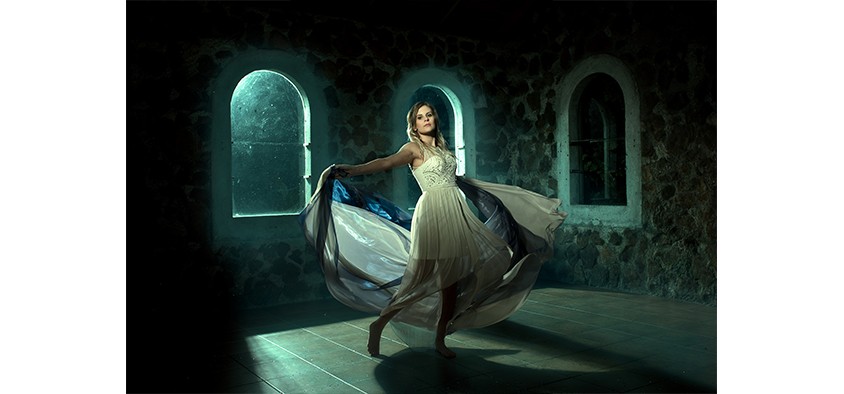 Photo of girl dancing with dramatic lighting