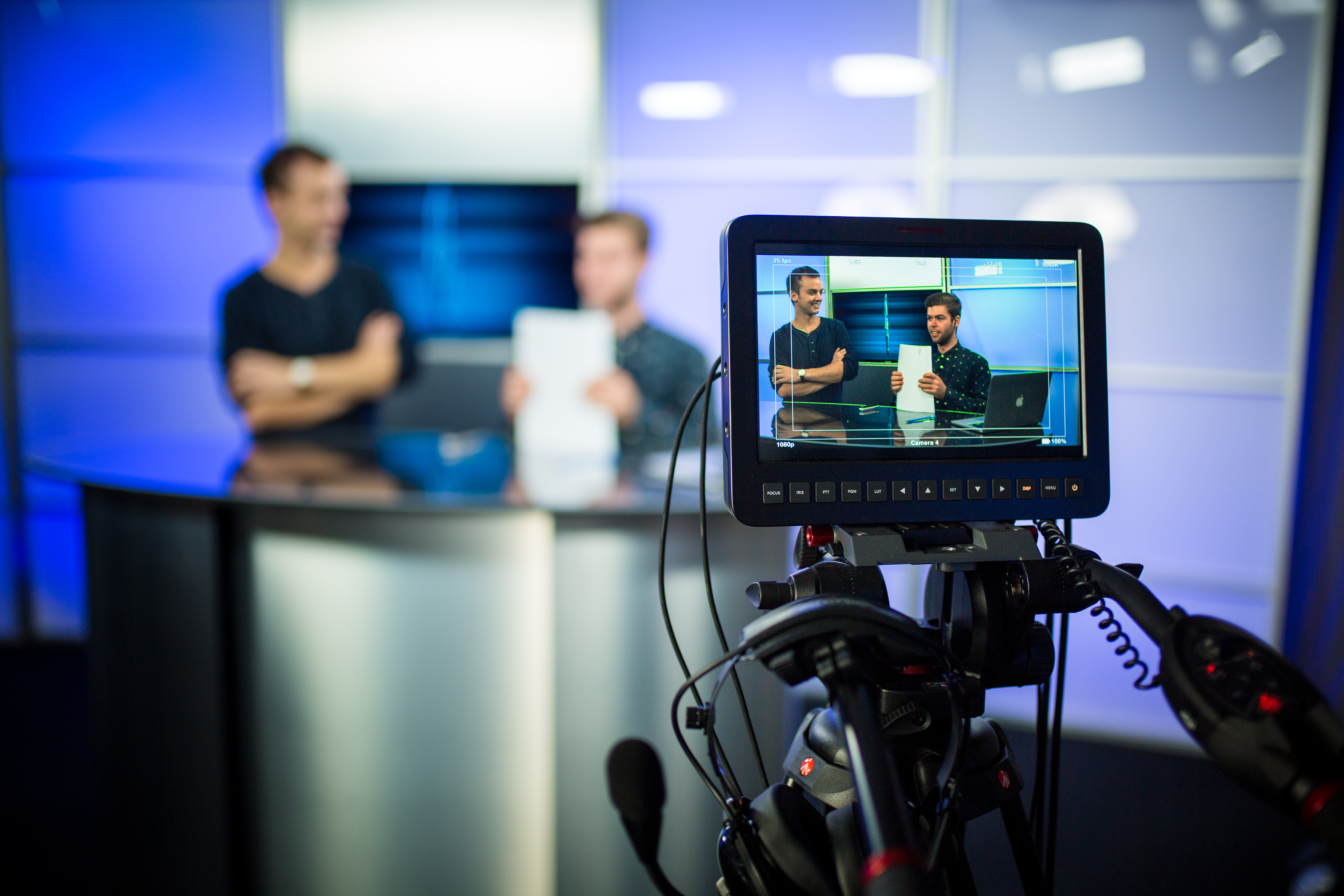 Two TV and Film students in the studio in front of camera.