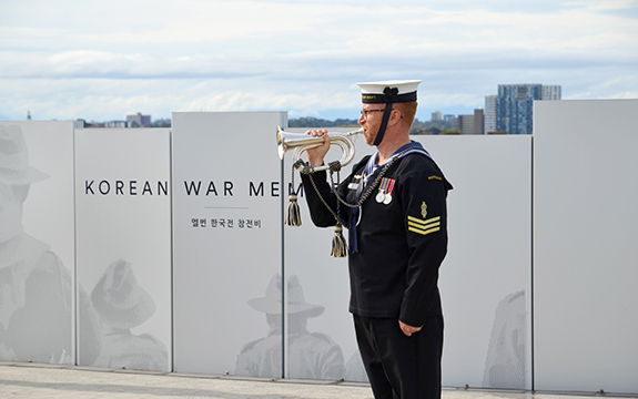 Soldier playing the last post at the memorial opening