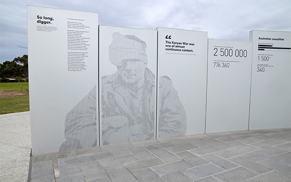 Australian soldier and graphics on perforated memorial panels