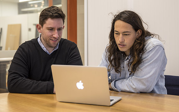 The Hearables 3D team using a laptop. 