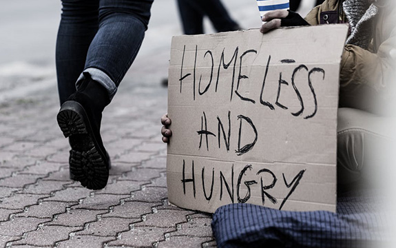 Sign that reads 'Homeless and Hungry'