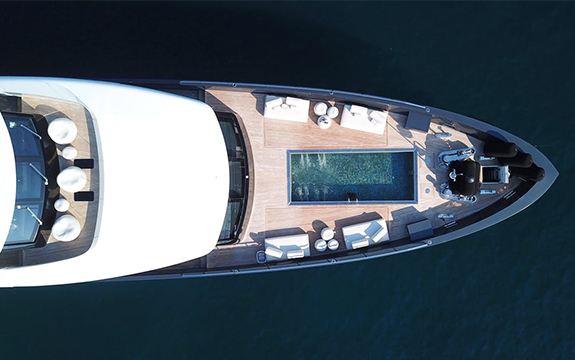 Birds eye view of a luxury boat sitting in the water.