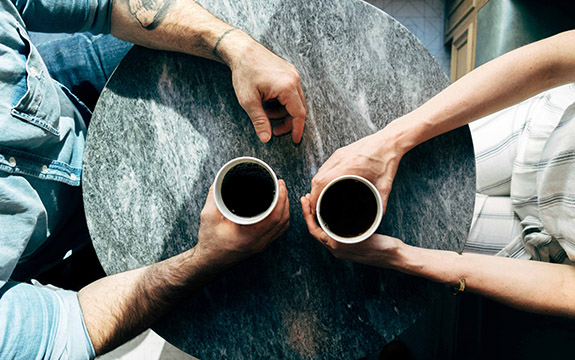 People drinking coffee. 