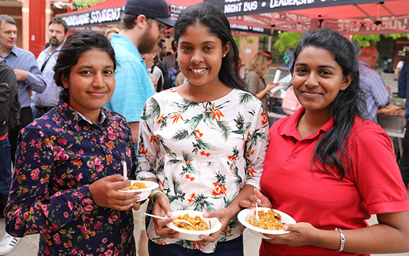 Students eating food at World Kitchen. 